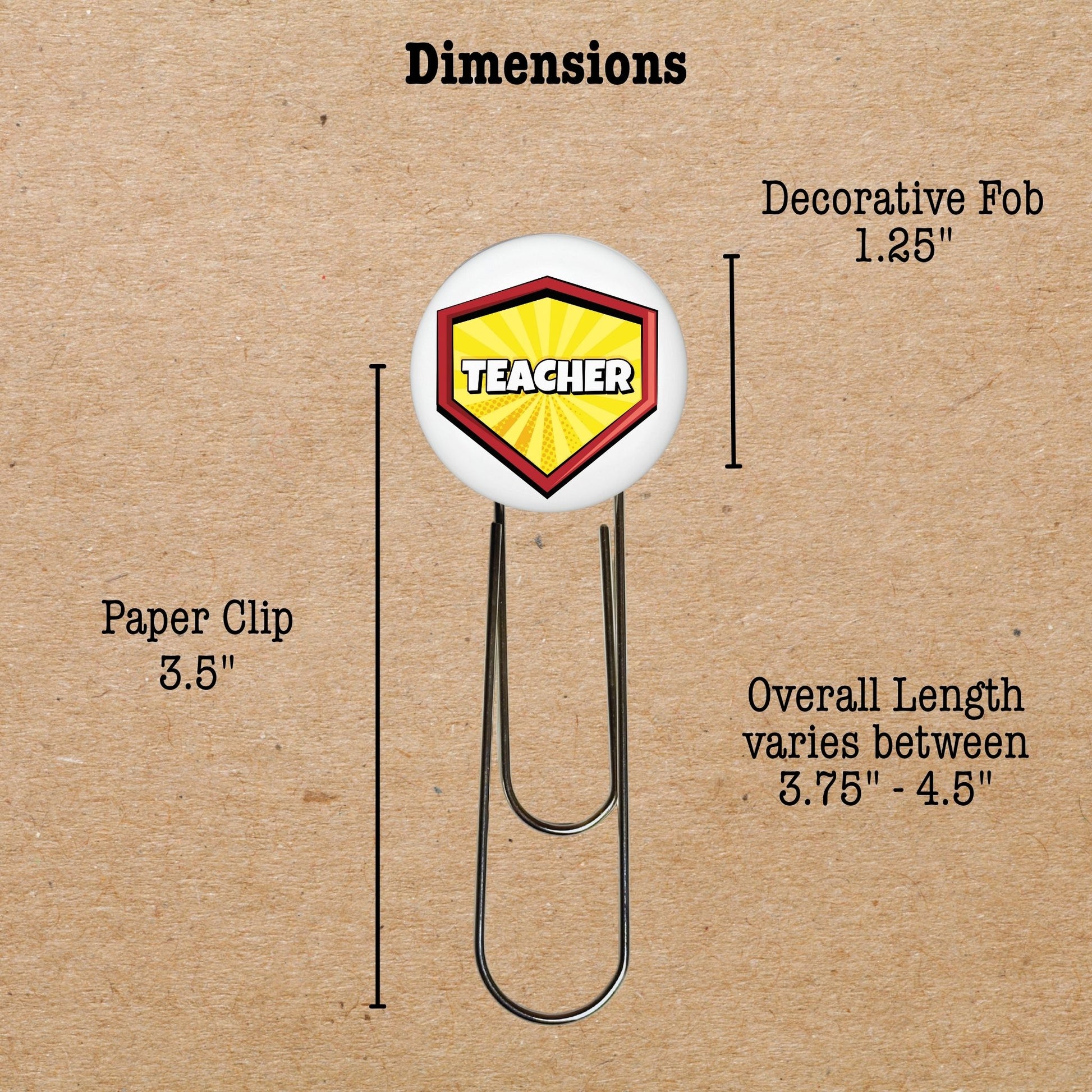 Measurement chart of a paper clip with a decorative fob labeled 'Teacher' on a brown background.